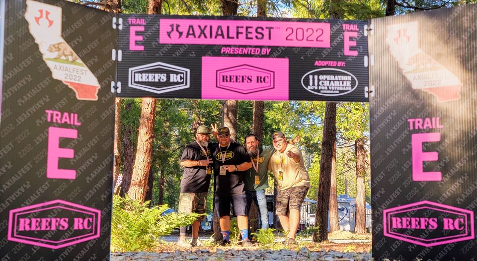 O11C members under the Trail E arch at Axialfest 2022